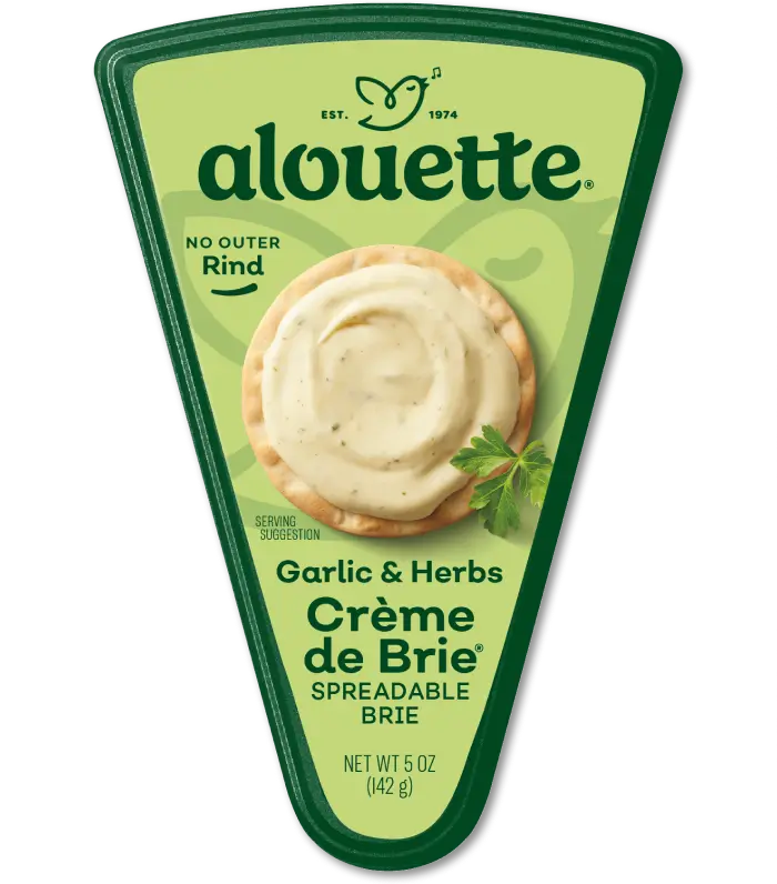 Alouette Garlic & Herbs Crème de Brie cheese spread in a wedge-shaped package with green label and creamy product visible.