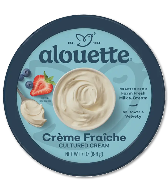 Alouette Crème Fraîche cultured cream container with strawberry and cream imagery on blue packaging, 10 oz net weight.