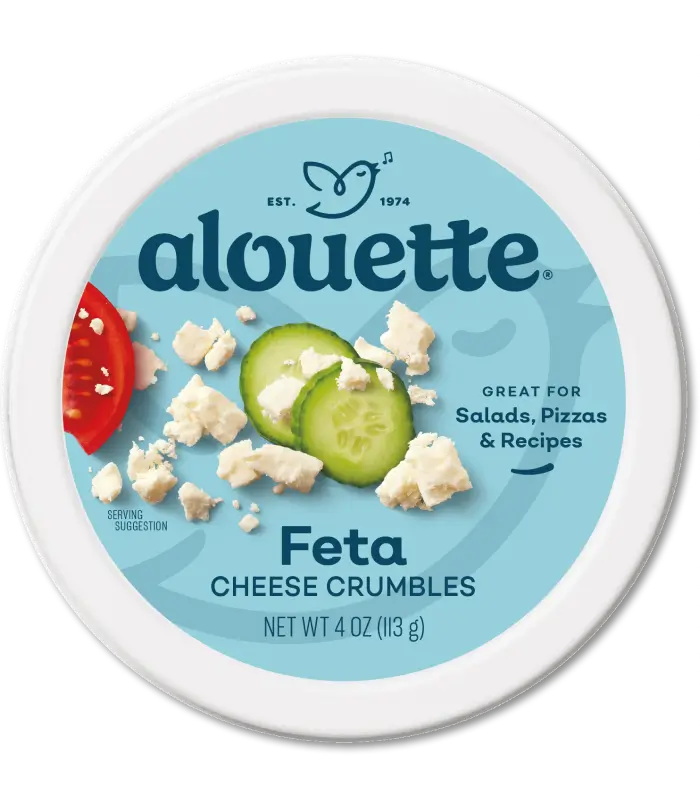 Alouette Feta Cheese Crumbles package with blue label, cucumber and tomato slices, 4 oz container.