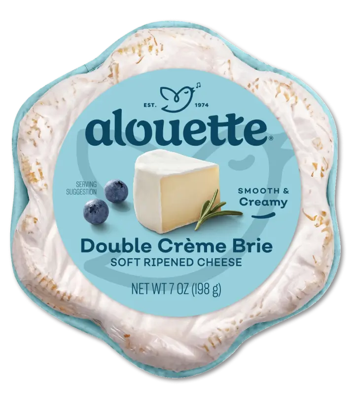 Alouette Double Crème Brie soft ripened cheese package, 7 oz, with blueberries on blue label.