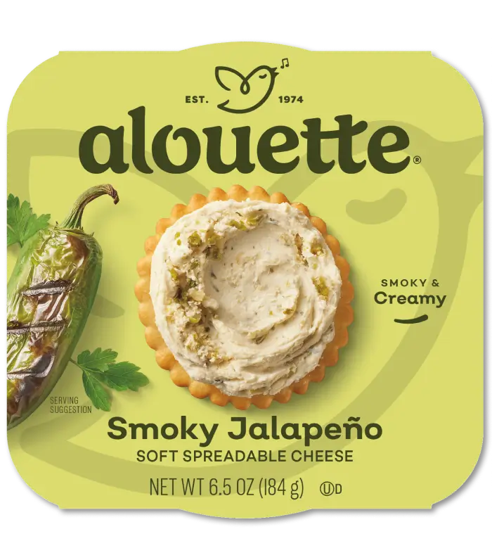 Alouette Smoky Jalapeño soft spreadable cheese package, 6.5 oz, featuring creamy cheese dip on crackers with jalapeño and herb imagery.