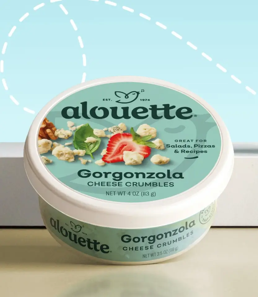 Alouette Gorgonzola cheese crumbles container with white lid on light surface against blue background with dashed circle graphic.