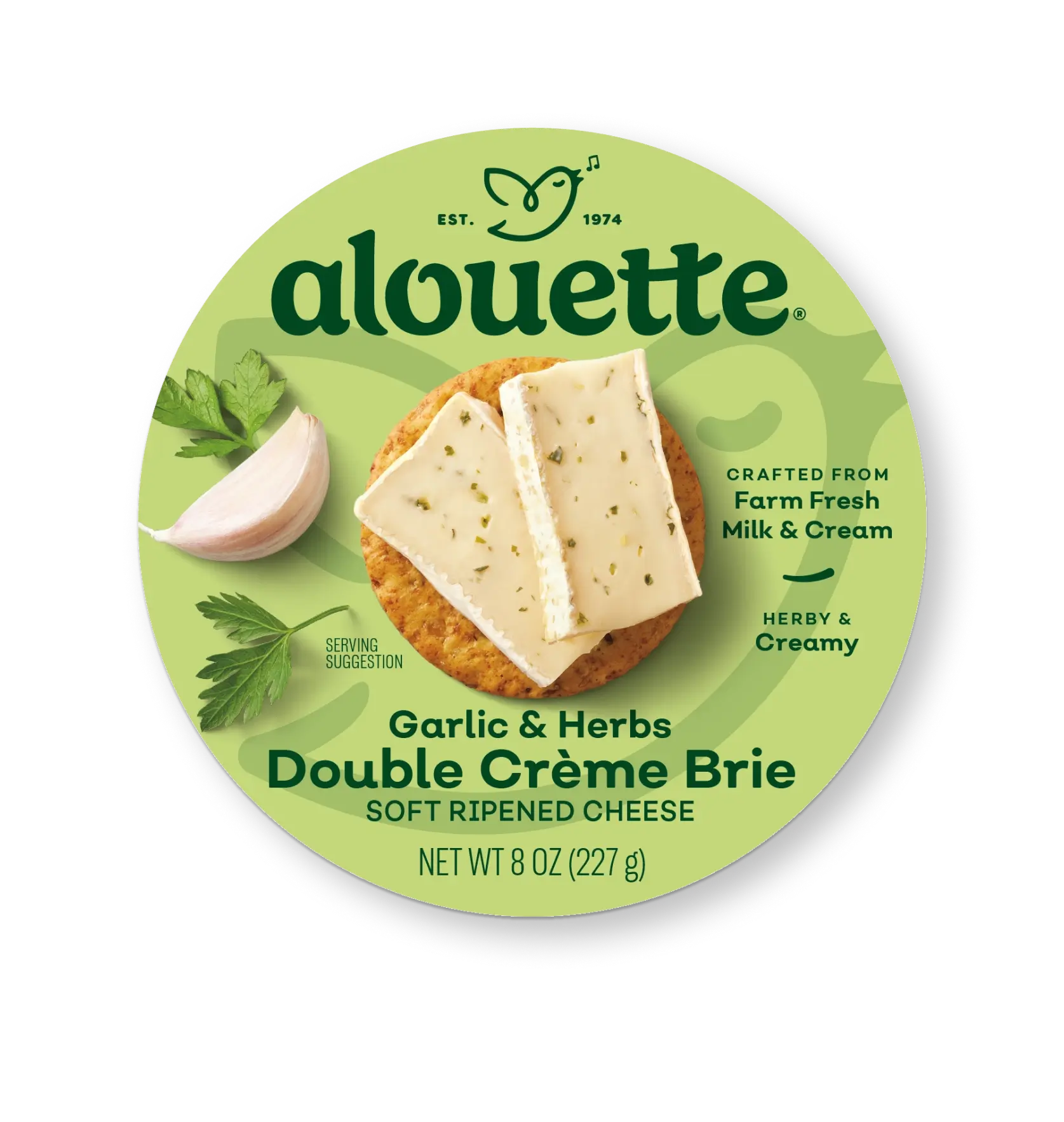 Alouette Garlic & Herbs Double Crème Brie cheese package with green label showing sliced cheese on a cracker and herbs, 8 oz net weight.
